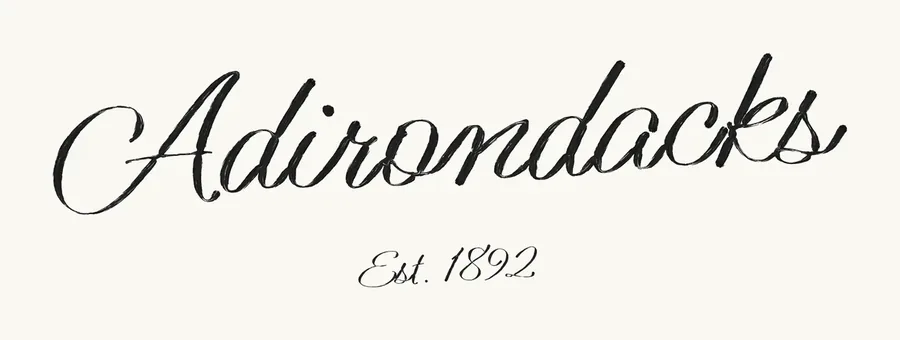 Adirondacks, Est. 1892, painted in a brush script.